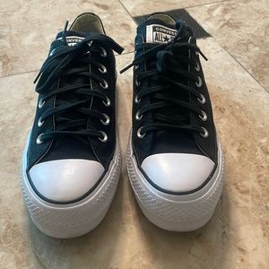 Black and white low top converse sneakers